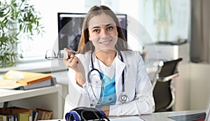 Portrait of smiling woman doctor in clinic