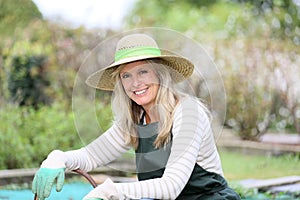 Portrait of smiling woman gardening