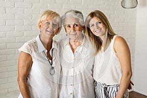 Portrait of a smiling woman , grandmother and granddaughter