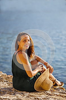 Portrait of smiling woman by seaside