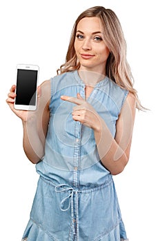 Portrait of a smiling woman showing blank smartphone screen isolated on a white background