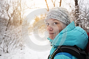 Portrait of smiling woman on the trail in the forest