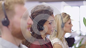 Portrait of smiling woman working in call center