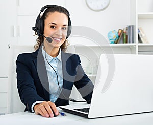 Portrait of smiling woman working in call center