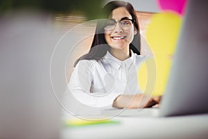 Portrait of smiling woman working in office