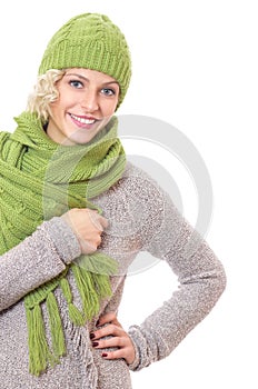 Portrait of a smiling woman wrapped with wool scarf