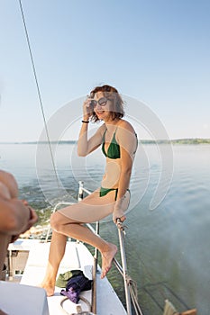 Portrait of a smiling woman on a yacht