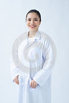 Portrait of smiling young asian female doctor in a background for your text