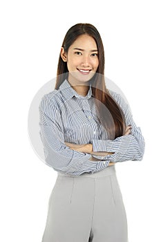 Portrait of smiling young beautiful Asian woman with long dark brown hair standing with arms crossed isolated on white background