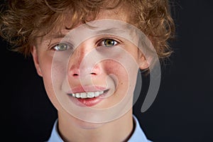 Portrait of smiling young boy 14 years old isolated over white background