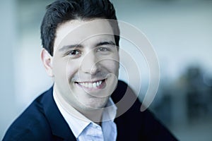 Portrait of smiling young businessman looking at the camera