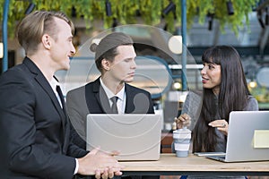 Portrait of a smiling young businessman and woman. Happy business people talking in Co Working space office