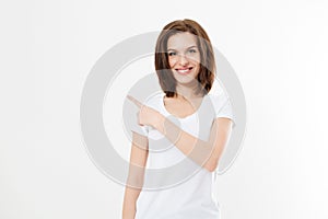 Portrait of smiling young caucasian woman wearing summer t shirt pointing at copy space by finger isolated on white template