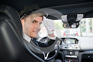 Portrait Of Smiling Young Chauffeur In Car