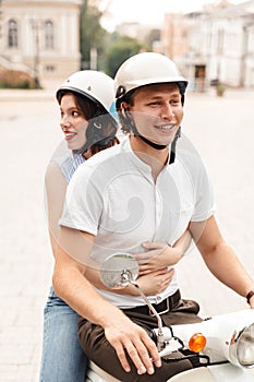 Portrait of a smiling young couple in helmets