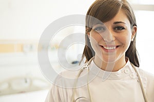 Portrait of smiling young female doctor in a hospital