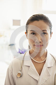 Portrait of smiling young female doctor in a hospital