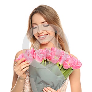 Portrait of smiling young girl with beautiful tulips on white background.