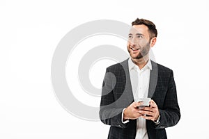 Portrait of a smiling young man holding mobile phone