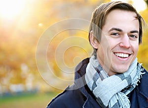 Portrait of a smiling young man standing outdoors