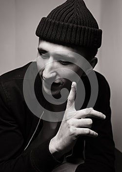 Portrait of smiling young  man  wearing black knit hat