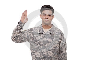 Portrait of a smiling young soldier performing oath