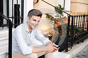 Portrait of smiling young stylish man dressed in shirt