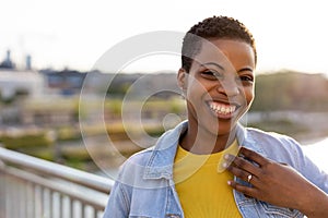 Portrait of smiling young woman in the city