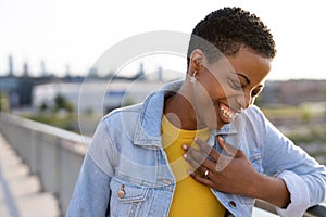 Portrait of smiling young woman in the city