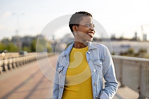 Portrait of smiling young woman in the city