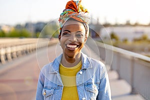 Portrait of smiling young woman in the city