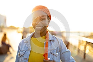 Portrait of smiling young woman in the city