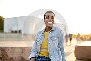 Portrait of smiling young woman in the city