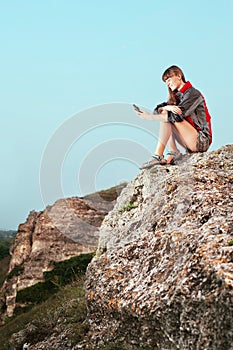 Portrait of a smiling young woman with GPS