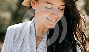 Portrait of a smiling young woman in a hat. Summer holidays