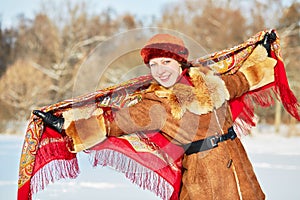 Portrait of smiling young woman in sheepskin short photo