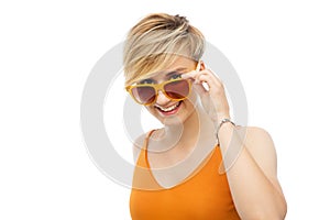 Portrait of smiling young woman in sunglasses