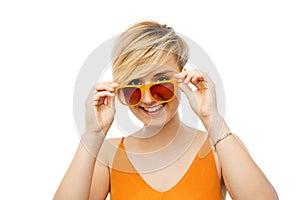 Portrait of smiling young woman in sunglasses