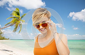 Portrait of smiling young woman in sunglasses