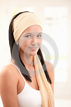 Portrait of smiling young woman wearing snood