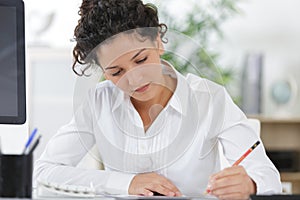 portrait smiling young woman working in creative studio