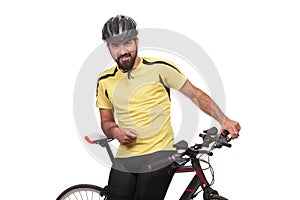 Portrait of smilling bicyclist with helmet and yellow shirt, posing with a bicycle, isolated on white