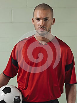 Portrait Of Soccer Player Holding Ball