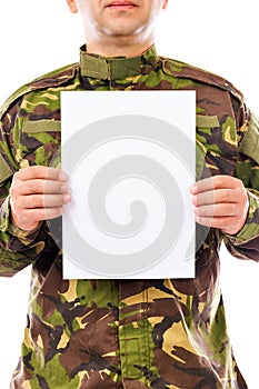 Portrait of a soldier holding white sheet of paper