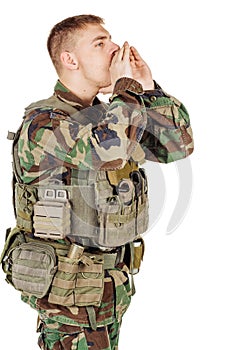 Portrait soldier or private military contractor shouting with hands cupped.