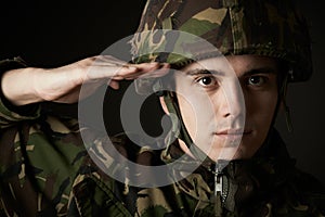 Portrait Of Soldier In Uniform Saluting
