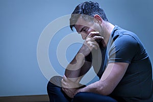 Portrait of sorrowful, grieving man photo
