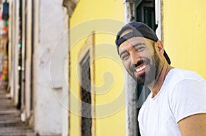 Portrait of a spanish man with snapback hat looking camera