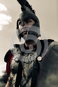 Portrait of Spartan warrior in armor and helmet