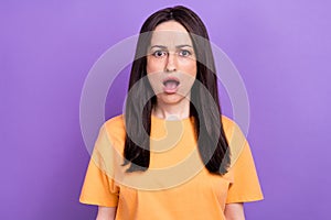 Portrait of speechless stunned girl with stylish hairdo wear oversize t-shirt astonished staring isolated on violet